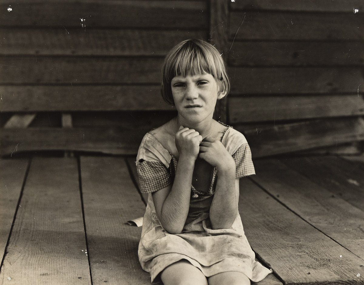 DOROTHEA LANGE (1895-1965) Girl on porch, Macon County, Georgia, July 1937.